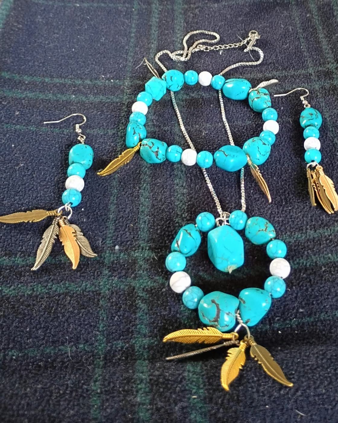 Four piece set of natural turquoise with metallic feathers: necklace, bracelet and two earrings